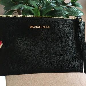 Micheal kors wristlet. Gently used one time.